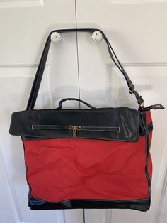 "In great shape  Velcro and zipper closure Ma made material  Width 18\" Height 13\"  Depth 6\"" Red Shoulder Travel Bag For Everyday Use, Red Tote Travel Bag For Everyday Use, Everyday Red Duffle Bag With Luggage Sleeve, Red Duffle Bag With Luggage Sleeve, Red Shoulder Travel Bag For Daily Use, Large Capacity Red Bag For Overnight Trips, Red Large Capacity Satchel Duffle Bag, Red Duffle Bag With Luggage Sleeve For Overnight Trips, Red Travel Bag With Luggage Sleeve For Daily Use