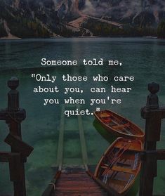 two boats sitting on top of a pier next to the ocean with a quote about someone told me only those who care about you, can hear you when you're quiet