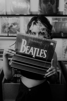 Images of a teen girl in a record store.