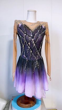 a purple and blue dress is on display