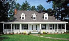 a white house with porches and windows