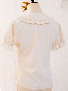 This price is for a blouse only.   	 		 			Size 			S 			M 			L 		 		 			Bust 			92 			96 			100 		 		 			Shoulders 			36 			37 			38 		 		 			Full Length 			55 			57 			59 		 		 			Sleeve Length 			19 			19.5 			20 Feminine Collared Cream Top, Cream Cotton Top With Peter Pan Collar, Feminine Cream Collared Top, Feminine Collared Beige Tops, Feminine Beige Collared Tops, Beige Short Sleeve Blouse, Spring Cream Blouse With Doll Collar, Beige Collared Top For Office, Solid Cotton Tops With Doll Collar