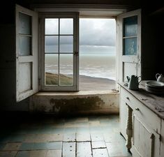 an open window in the middle of a kitchen