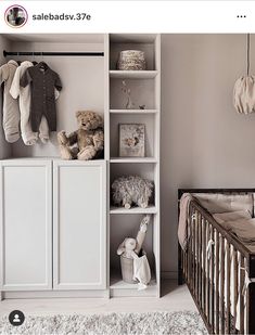 a baby's room with a crib and shelves filled with stuffed animals on top of them