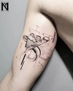 a man's arm with a tattoo on it that has geometric shapes and lines