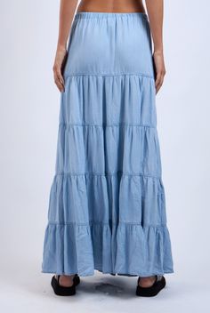 The Denim Days Maxi Skirt features a lightweight denim fabric and tiered ruffle design. Perfect for year-round wear and has an drawstring waistband for all-day comfort Material & Care: Made from 100% Tencel. For best care, machine wash cold with like colors on a gentle cycle. Use a mild detergent. Avoid bleach. Hang to dry. Iron on low heat if needed Size & Fit: Model is 5'8" wearing size small Bust: 34B Waist: 24 Hips: 34 Ruffle Design, The Blues, Tiered Maxi Skirt, Modern Chic, Denim Maxi, Drawstring Waistband, Denim Day, Denim Maxi Skirt, Top Graphic Tees