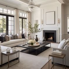 a living room filled with furniture and a fire place in the middle of a room