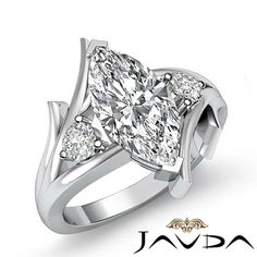 a white gold ring with two pear shaped diamonds