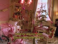 a bedroom decorated for christmas with pink walls and lights on the ceiling, two children's rocking chairs in the foreground