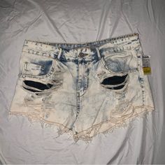 New With Tags! Super Short Jean Shorts. Acid Wash. Never Worn! Trendy White Jeans With Built-in Shorts, Distressed Denim Beach Bottoms, Distressed Denim Bottoms For Beach, White Ripped Denim Jean Shorts, White Distressed Denim Shorts, White High-waisted Denim Jean Shorts, Distressed Cotton Blue Jean Shorts, Blue Distressed Cotton Jean Shorts, Blue Distressed Cotton Shorts