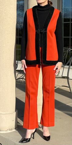 This is a vintage orange knit 2 piece pant suit or vest and matching pants. This lovely modern suit is clean and in great condition with no concerns. This vintage orange knit vest and pants were made by Alfred Werber and the vest is lined and the pants are not. The pants have elastic going around the waist and they quite high waisted. The vest has beautiful faux or real Persian Lamb fur trim bordering the entire vest and there is one frog cloth closure on the vest. I am a size S and I am the one Fitted Orange Vest For Fall, Persian Lamb, Modern Suits, Orange Knit, Fur Cape, Womens Suits, Belted Jacket, Pant Suit, Leather Trench Coat