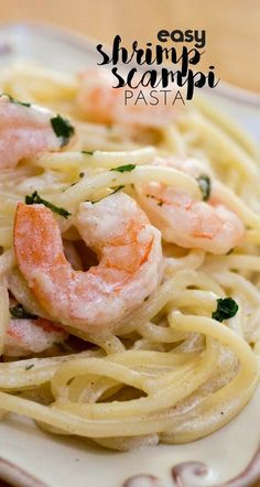 shrimp scampi pasta on a plate with parsley in the background and text overlay that reads easy shrimp scampi pasta