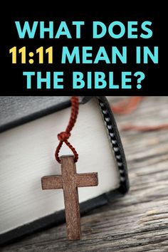 a cross that is on top of a book with the title what does 11 11 mean in the bible?