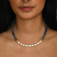 Indulge in the elegance of our captivating statement pearl necklace, meticulously adorned with denim blue-faced jasper beads and contemporary gold accents. Beyond its exquisite aesthetics, this necklace is thoughtfully crafted to emanate healing and spiritual energies. Jasper is revered for its grounding properties, promoting harmony and stability, while pearls symbolise purity and spiritual transformation. Contemporary Pearl Necklace, Pearl Statement Necklace, Spiritual Transformation, Jasper Beads, Freshwater Pearl Necklaces, Wedding Jewellery Necklace, Gold Accents, Wedding Necklace, Blue Denim