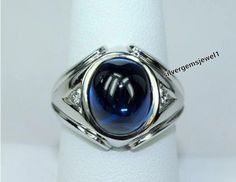 a ring with a blue stone in it