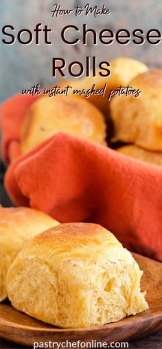 two pieces of soft cheese rolls on a wooden plate with a red towel in the background