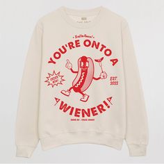 Printed Sweatshirt By Batch1 Slogan To Front: “You’re Onto A Wiener” Graphics: Vintage Style Hot Dog Character Print: Organic, Water-Based, Eco-Friendly Ink Style: Crew Neck, Long Sleeves Fit: Relaxed, Unisex Size Guide: Large Material: 80% Cotton, 20% Polyester, Brushed Fleece Inside Hot Dog Graphic, Hot Dog Shirt, Dog Character, Graphics Vintage, Uniform Ideas, Club Ideas, Boys Swim, Long Live, Retro Tshirt