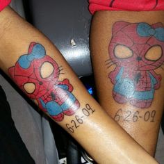 two people with matching tattoos on their legs, one has spiderman and the other has cat