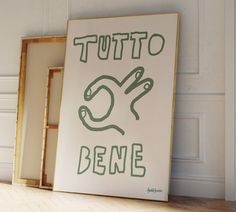 there is a sign that says totto bene on the wall next to it