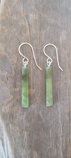 Wyoming Jade Earrings. Lovely cloudy apple green color. Very translucent and lightweight. I used .925 solid sterling for the ear wires and jump rings. All of our jade is handcarved and polished. There may be imperfections in the shape and polish. We leave a slightly matte finish on most pieces. This gives them a very natural and smudge free look.  Thank you for visiting our listing! Green Jade Earrings For Pierced Ears, Green Sterling Silver Earrings With Ear Wire, Green Minimalist Sterling Silver Earrings, Minimalist Green Sterling Silver Earrings, Green Jade Nickel-free Earrings, Nickel-free Green Jade Earrings, Green Nickel-free Jade Earrings, Handmade Green Sterling Silver Earrings, Green Minimalist Pierced Earrings