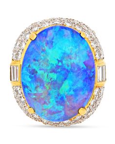 Elegance in motion and remarkable hues distinguish the captivating opal showcased in this attention-commanding ring. Weighing an impressive 22.75 carats, this exceptional gem showcases a mesmerizing interplay of serene blues and greens harmoniously juxtaposed with vivid oranges and reds. Set in 18K yellow gold, 3.50 total carats of white diamonds embellish the setting, offering a delicate yet dazzling complement. Among the world's most coveted gemstones, opals hold a coveted status, and discover Antique Opal Jewelry, Golconda Diamond, Opal And Diamond Ring, Ammolite Jewelry, Ring Opal, Jewelry For Sale, Art Consultant, Girl Jewelry, Blue Jewelry