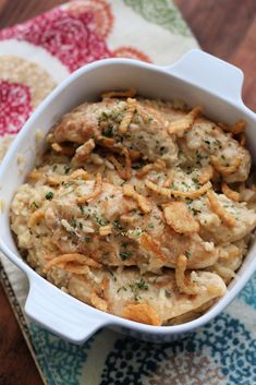 a casserole dish filled with chicken and cheese