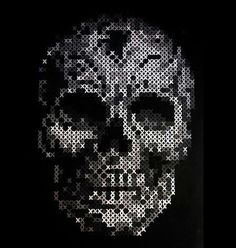 a skull made out of white dots on a black background, with the words written in it