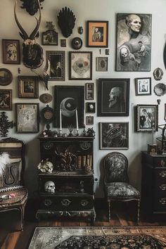 a living room filled with lots of pictures on the wall next to a chair and table