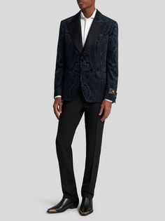 Cotton velvet evening blazer, decorated with a metallic placed paisley print, reconstructed all over. This model is embellished with a tailored label, hand-stitched onto the cuff. It features a contrasting paisley undercollar and a lining embellished with a tone-on-tone floral striped design.• Regular fit• Silk canneté peak lapels• Single-breasted closure with jewelled buttons• Welt breast pocket• Side flap pockets• Cuffs with jewelled buttons• Rear vent• Made in Italy• The model is 6’2” (188 cm) tall and wears a size 48 (IT)
• 100% cotton• Lining: 100% viscose Poncho Jacket, Suit Shirts, Best Wallet, Fragrance Collection, Socks And Tights, Cotton Velvet, Tie And Pocket Square, Newborn Outfits, Clothes Gift