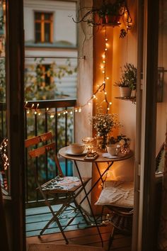 the balcony is decorated with lights and potted plants, while two chairs are set outside