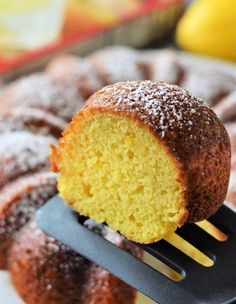 a bundt cake being held by a spatula