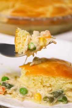 a piece of cornbread casserole being lifted from a plate with a fork