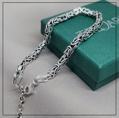 925 Sterling Silver MEN BYZANTINE chain bracelet, heavy silver bracelet for men and women, unisex wide bracelet, gift for valentine's day Dimensions: - Length: 19 cm + 5 cm chain extension. - Width: 5 mm. - Weigth: 18 g. Material: 925 Sterling Silver. Nickel free. Original Turkish product. ALL OUR PRODUCTS ARE PACKED IN AN ELEGANT JEWELLERY BOX WITH OUR LOGO. They are perfect for a gift. THE PRODUCTS WILL BE SENT WITHIN MAX 2 DAYS. DELIVERY TIME: Depends on the recipient's country FREE DELIVERY. Silver Bracelet For Men, Byzantine Chain, Silver Chain Style, Wide Bracelet, Bracelet For Men, Silver Art, Original Gift, Silver Man, Elegant Jewelry