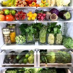 an open refrigerator filled with lots of fresh fruits and vegetables