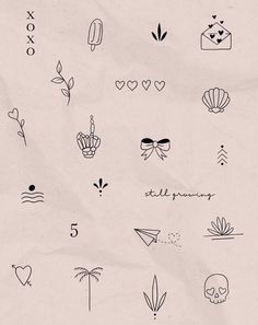 the back side of a piece of paper with various tattoos on it, including hearts and flowers