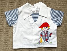 a child's shirt with an image of a boy on it