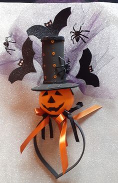 a halloween decoration with bats and a top hat