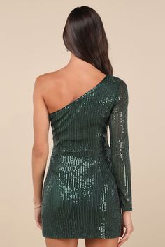 Being the life of the party is easy with a remarkable look like the Lulus All Time Shine Emerald Sequin One-Shoulder Mini Dress! Glittering sequins dazzle across a stretchy mesh overlay (atop a matching knit liner) that shapes a trendy one-shoulder neckline and a sheer long sleeve. The fitted waist tops a flirty bodycon skirt that finishes at a modern mini hem. Hidden side zipper/clasp. Fit: This garment fits true to size. Length: Mid-thigh. Size medium measures 32" from shoulder to hem. Bust: Great for any cup size. Waist: Fitted - very fitted at natural waist. Hip: Fitted - stretchy fabric allows room for hips. Undergarments: May be worn with a strapless bra, adhesive bra, petals, or no bra. Fabric: Fabric is very stretchy. Lined. Shell: 95% Polyester, 5% Spandex. Lining: 100% Polyester. Navy Blue Sequin Dress, Sequin Homecoming Dress, Blue Sequin Dress, Sheer Long Sleeve, Bodycon Skirt, Life Of The Party, Mesh Overlay, Body Con Skirt, Large Size Dresses