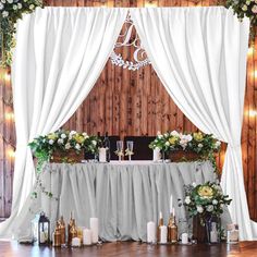 the table is set up with candles, flowers and other decorations for an elegant wedding