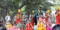 some people in colorful outfits are performing on stage