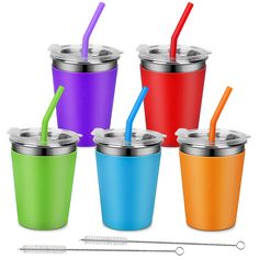 four different colored cups with straws in them next to a thermos cup