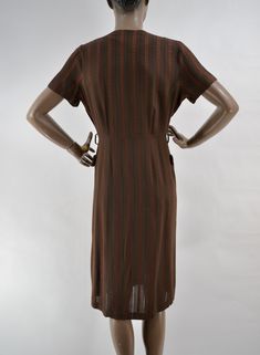 "50's super soft woven dress. Rich brown, with brick red striped pattern. In between stripes are woven alternating stiching to create a checkerboard pattern with negative space, and a little peek-a-boo to the skin. Darling button collar and outside front pockets Slight fading under armpits. In excellent used condition. No belt. 15\" shoulders 12\" sleeve 40\" chest 30\" waist 40\" hips 42\" length" Vintage Brown Midi Length Dress, Vintage Brown Midi Dress For Fall, Vintage Brown Lined Dress, Retro Brown Lined Dress, Vintage Brown Knee-length Dress, Retro Brown Dress For Daywear, Retro Brown Dresses For Daywear, Retro Brown Dress For Fall, Retro Brown Midi Dress