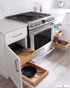 an open drawer in the middle of a stove