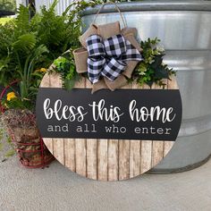 a wooden sign that says, bess this home and all who enter are welcome