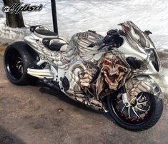 the motorcycle is decorated with skulls and bones