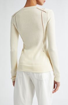 The German design house known for its minimalist essentials masterfully knits rich wool-and-cotton yarn to create an intricately pointelle-detailed sweater. Crewneck Long sleeves Ribbed cuffs and hem 67% wool, 33% cotton Dry clean Made in Italy Designer Clothing Luxury Fine Knit Merino Wool Top, Luxury Fine Knit Cashmere Top, Spring Cashmere Sweater With Pointelle Knit, Chic Cashmere Sweater With Pointelle Knit, Spring Wool Sweater With Pointelle Knit, Wool Pointelle Knit Sweater For Spring, Fitted Cashmere Pointelle Knit Tops, Elegant Wool Sweater With Pointelle Knit, Fitted Pointelle Knit Cashmere Tops