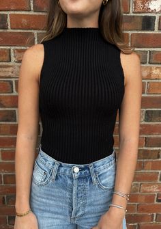 Knit ribbed mock neck sleeveless top. Gabriela is wearing a size medium. Sleeveless Mockneck Top Outfit, Turtle Neck Sleeveless Outfit, Sleeveless Mock Neck Top Outfits, Turtleneck Tank Top Outfit, Mock Neck Top Outfit, Sleeveless Turtleneck Outfit, 2024 Ootd, Lady Outfit, Turtle Neck Sleeveless