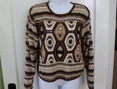 Groovy multicolor crochet sweater in beige, tan, black, brown and white from the 1990s. Perfect for your boho or hippie style. Cotton/ramie blend means it is not itchy like wool - hand washable. Tag size medium - Laying flat UNstretched it measures 18" across (36 inches total); 19 inches long. In good condition - Clean (freshly laundered), no stains, no holes, shows only a little wear.  Measured flat so fit may vary - be sure to measure a similar garment that fits you for comparison. For more vintage clothing for women and men from the 1960s, 1970s, 1980s, & 1990s, visit  https://www.etsy.com/shop/VirgieMae Multicolor Crochet, Hippie Crochet, Mode Hippie, Boho Sweater, Pullover Sweater Women, 60s Fashion, Crochet Sweater, Hippie Style, Women Pullover