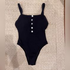 Top Selling One Piece. Extremely Flattering For All Shapes. Almost Functions Like Shape Wear! Cinches The Waist And Provides Good Top Support With Adjustable Straps. Black Ribbed Trendy Bodysuit, Summer Beach Ribbed Bodysuit, Summer Vacation Ribbed Bodysuit, Chic Ribbed Bodysuit For The Beach, Casual Ribbed Bodysuit For The Beach, Summer Ribbed Bodysuit For Beach, Casual Solid Swimwear For Night Out, Summer Ribbed One-piece Bodysuit, Summer Fitted Ribbed Bodysuit