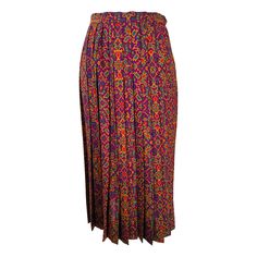 Vintage Yves Saint Laurent Rive Gauche moorish print challis knife pleated skirt from the 1970s. Rich colour printed, fine wool fabric, in shades of purple, green, red and amber. Sharp open pleated skirt has a banded waist with a side painted metal zipper closure with a bar hook at the waist. Unlined. Marked size 36, fits like a 4/small. There is a 3 1/4" hem, the skirt could be made longer. In excellent wearable condition. All our clothing is dry cleaned and inspected for condition and is ready to wear. Any condition issues will be noted. For visual comparison our mannequin is a size 4. Please check the measurements provided below and compare with your own measurements for the best possible fit! Please contact us if you have any questions about this item or need more photos. Measurements Knife Pleated Skirt, Vintage Yves Saint Laurent, Knife Pleat, Siding Paint, Rive Gauche, Painted Metal, Metal Zipper, Wool Fabric, Shades Of Purple